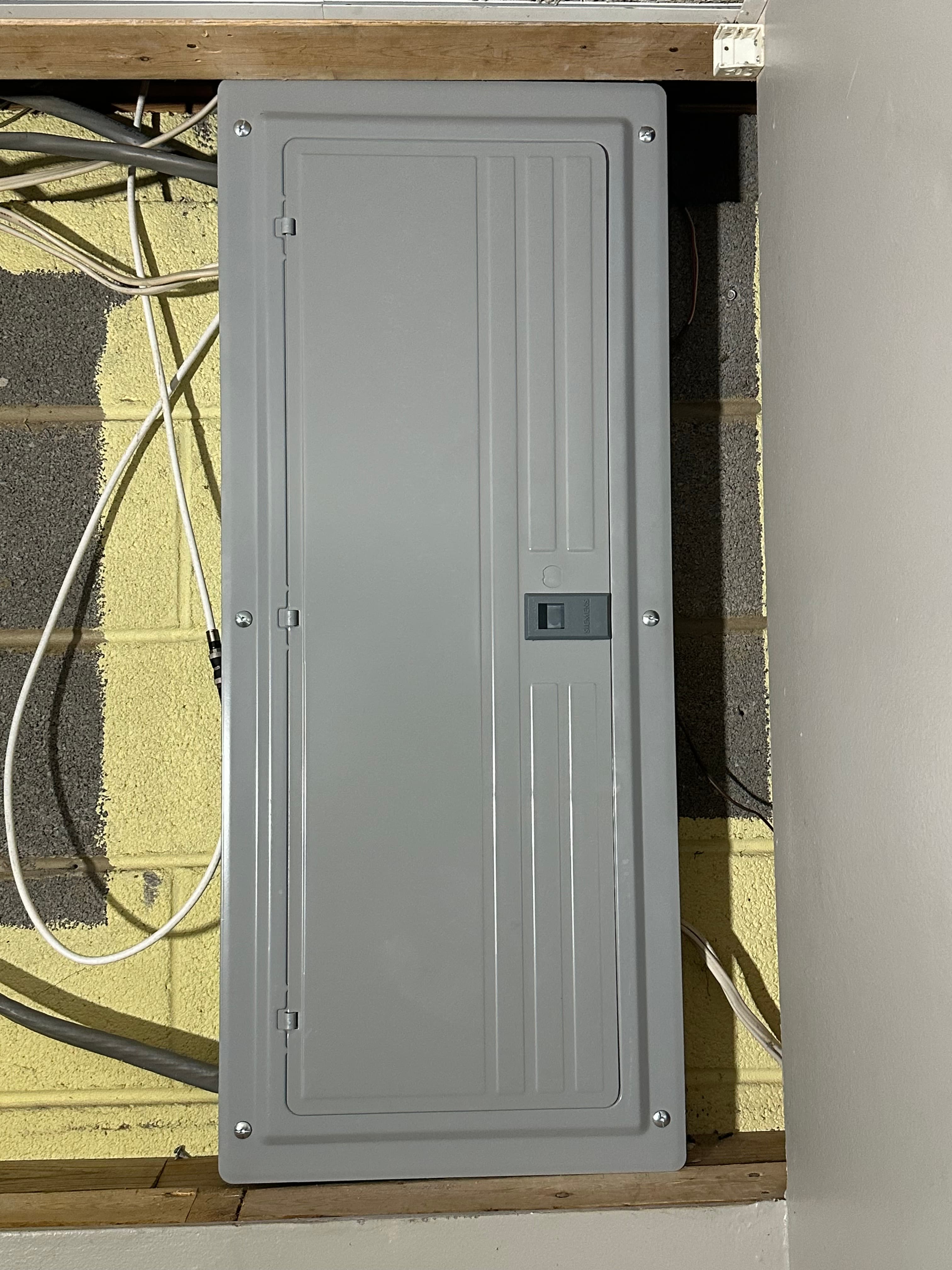 New electrical panel with its cover closed at the Blacksburg home