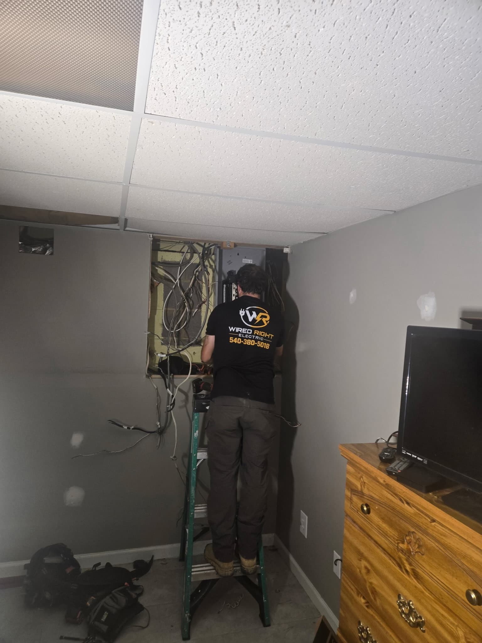Shane working at the interior electrical panel on the Blacksburg job
